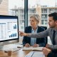 Construction CFO and finance team evaluating the best construction ERP for NetSuite on screen